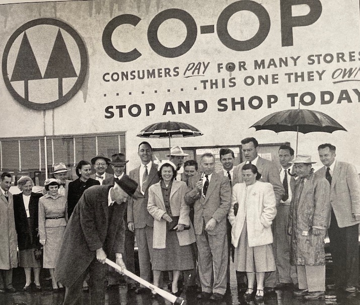 Crowd outside a Berkeley Co-op store beneath a grand-opening sign