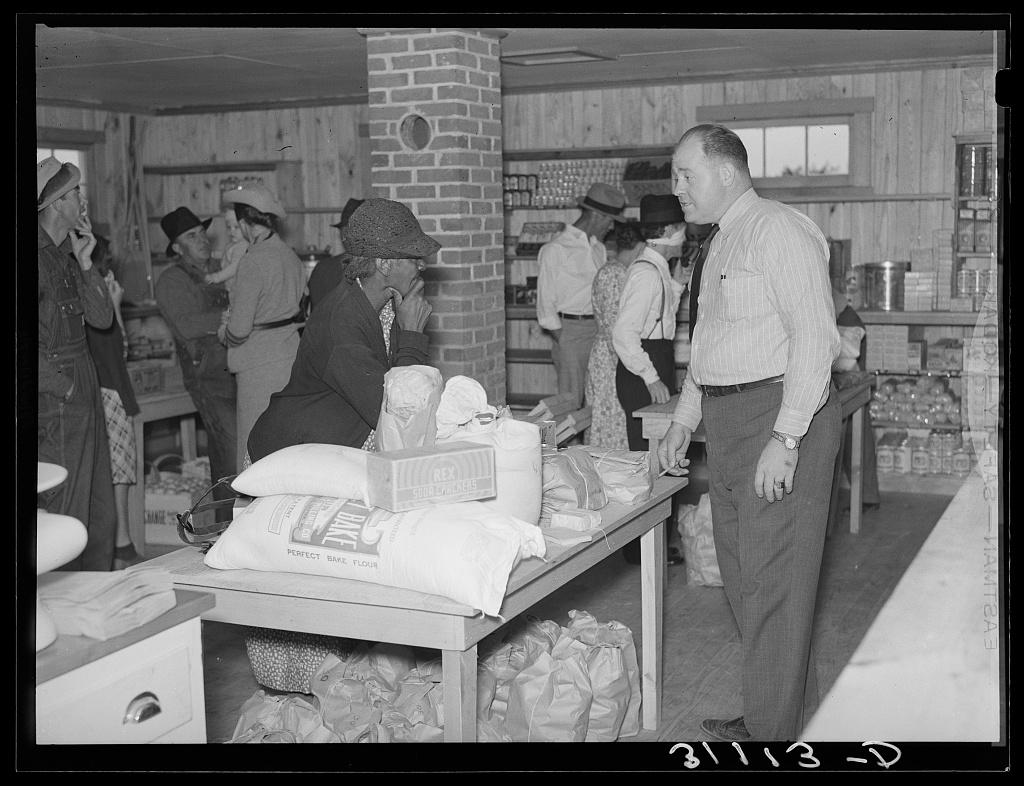 Customers making a purchase at the La Forge cooperative store in Missouri